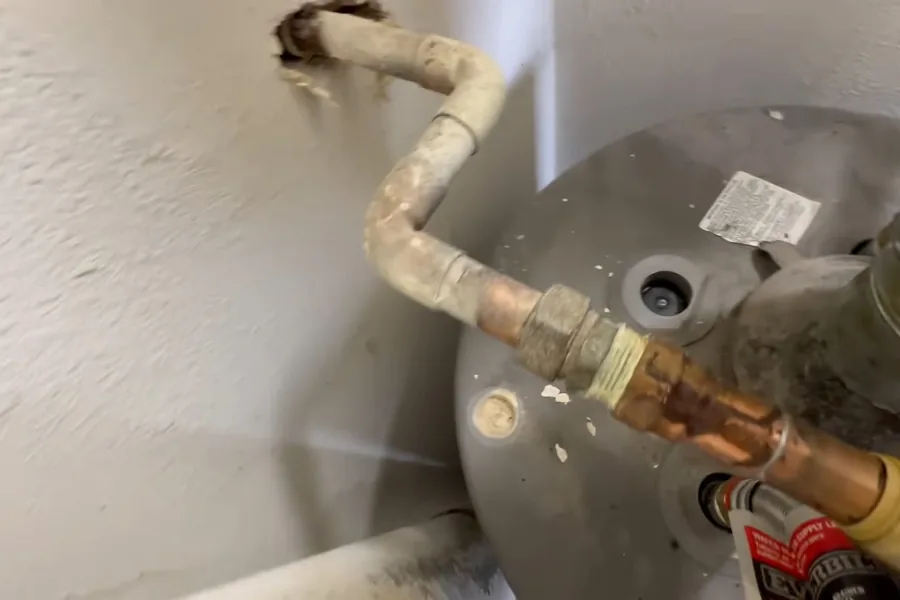 Water heater anode rod and tank connection showing mineral wear for Faucet & Fixture Installation in Fountain Valley, CA in Fountain Valley